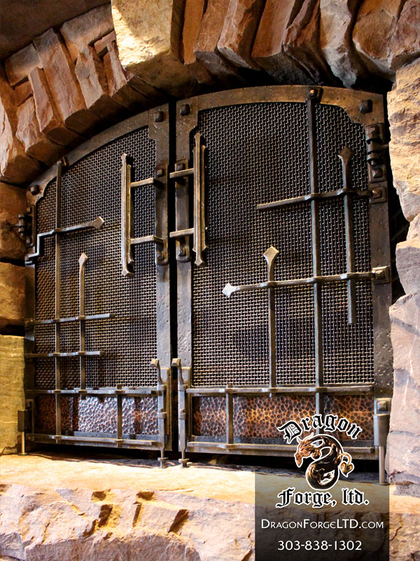 Great Northern Lodge modern rustic blacksmith fireplace doors